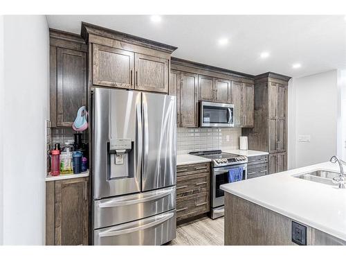 14 Yorkstone Walk Sw, Calgary, AB - Indoor Photo Showing Kitchen With Double Sink With Upgraded Kitchen