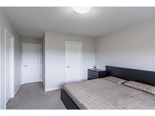 14 Yorkstone Walk Sw, Calgary, AB - Indoor Photo Showing Bedroom