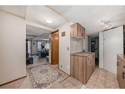 224 Edgebank Circle Nw, Calgary, AB - Indoor Photo Showing Living Room With Fireplace