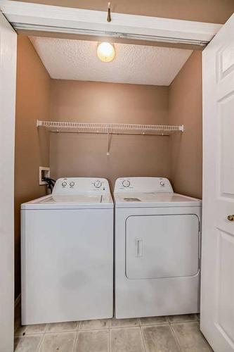 69 Saddlehorn Crescent, Calgary, AB - Indoor Photo Showing Laundry Room