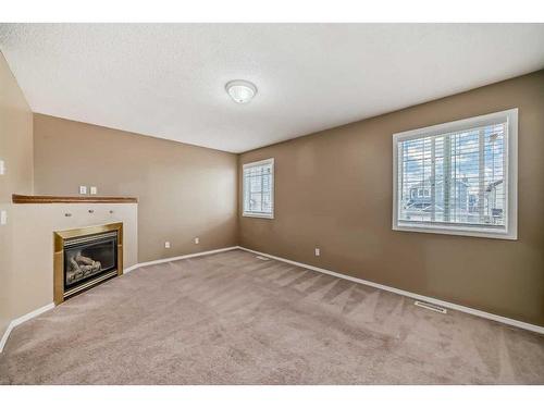 69 Saddlehorn Crescent, Calgary, AB - Indoor With Fireplace