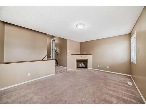 69 Saddlehorn Crescent, Calgary, AB - Indoor With Fireplace