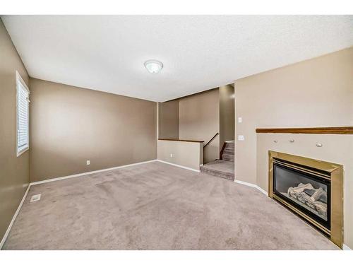69 Saddlehorn Crescent, Calgary, AB - Indoor With Fireplace