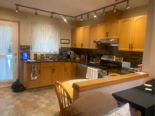 64 Dovista Court Se, Calgary, AB - Indoor Photo Showing Kitchen With Double Sink