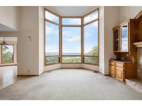 29 Edelweiss Point Nw, Calgary, AB - Indoor Photo Showing Living Room With Fireplace