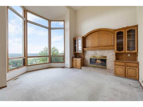 29 Edelweiss Point Nw, Calgary, AB - Indoor With Fireplace