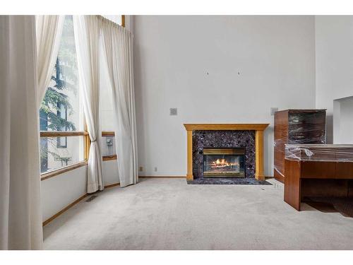 29 Edelweiss Point Nw, Calgary, AB - Indoor With Fireplace