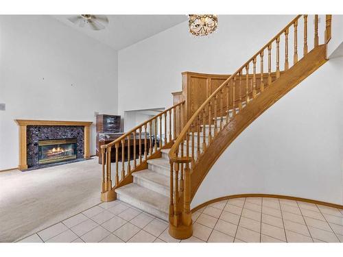 29 Edelweiss Point Nw, Calgary, AB - Indoor With Fireplace