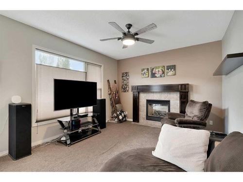 31 Copperstone Mews Se, Calgary, AB - Indoor Photo Showing Living Room With Fireplace