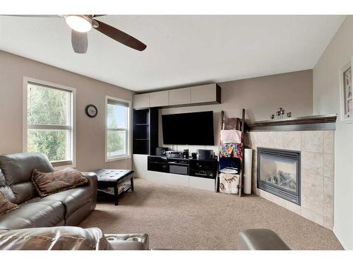 31 Copperstone Mews Se, Calgary, AB - Indoor Photo Showing Living Room With Fireplace