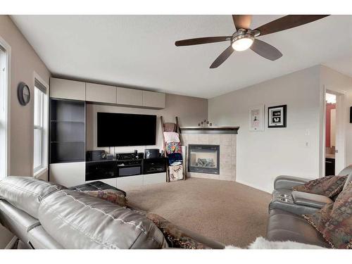 31 Copperstone Mews Se, Calgary, AB - Indoor Photo Showing Living Room With Fireplace