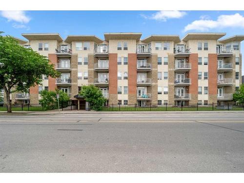 401-1410 2 Street Sw, Calgary, AB - Outdoor With Balcony With Facade