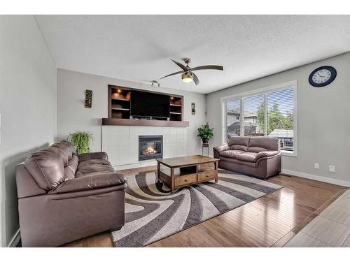 112 Auburn Bay Avenue Se, Calgary, AB - Indoor Photo Showing Living Room With Fireplace