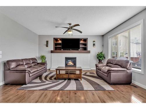 112 Auburn Bay Avenue Se, Calgary, AB - Indoor Photo Showing Living Room With Fireplace