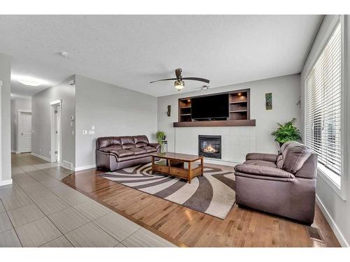 112 Auburn Bay Avenue Se, Calgary, AB - Indoor Photo Showing Living Room With Fireplace