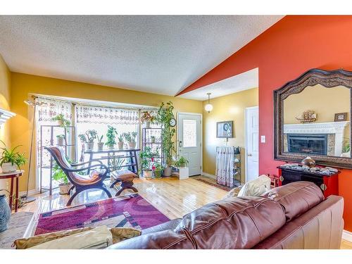 4 Cedargrove Road Sw, Calgary, AB - Indoor Photo Showing Living Room With Fireplace