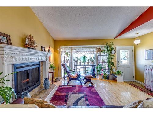 4 Cedargrove Road Sw, Calgary, AB - Indoor Photo Showing Living Room With Fireplace