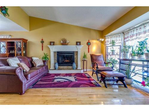 4 Cedargrove Road Sw, Calgary, AB - Indoor Photo Showing Living Room With Fireplace