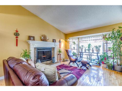 4 Cedargrove Road Sw, Calgary, AB - Indoor Photo Showing Living Room With Fireplace