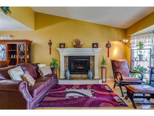 4 Cedargrove Road Sw, Calgary, AB - Indoor Photo Showing Living Room With Fireplace