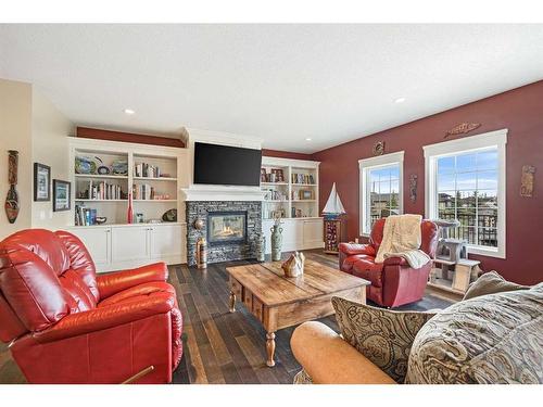 81008 404 Avenue East, Rural Foothills County, AB - Indoor Photo Showing Living Room With Fireplace