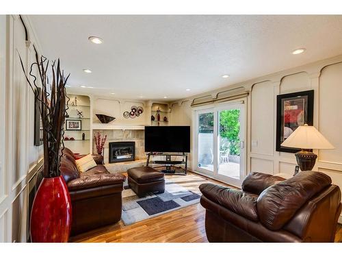 16 Woodfield Way Sw, Calgary, AB - Indoor Photo Showing Living Room With Fireplace