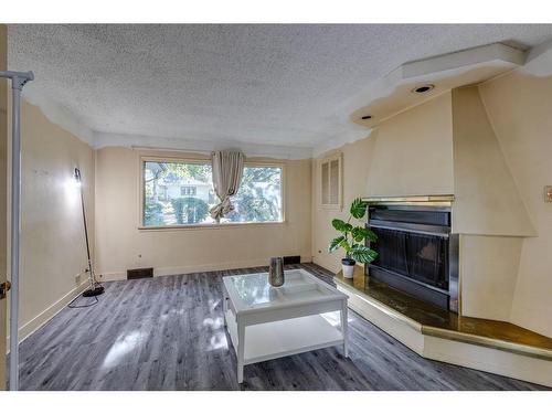 1619 9 Street Nw, Calgary, AB - Indoor Photo Showing Living Room With Fireplace