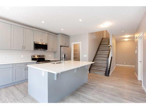 176 Hillcrest Drive Sw, Airdrie, AB - Indoor Photo Showing Kitchen With Stainless Steel Kitchen With Upgraded Kitchen