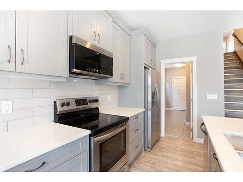 176 Hillcrest Drive Sw, Airdrie, AB - Indoor Photo Showing Kitchen With Stainless Steel Kitchen With Upgraded Kitchen