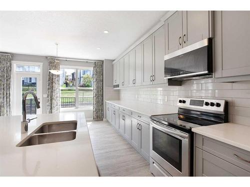 176 Hillcrest Drive Sw, Airdrie, AB - Indoor Photo Showing Kitchen With Stainless Steel Kitchen With Double Sink With Upgraded Kitchen