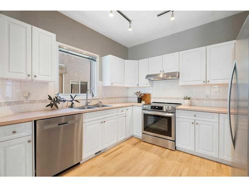 2-1924 25 Street Sw, Calgary, AB - Indoor Photo Showing Kitchen With Double Sink