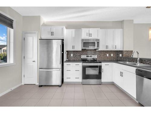 39 Kinlea Way Nw, Calgary, AB - Indoor Photo Showing Kitchen With Stainless Steel Kitchen With Double Sink