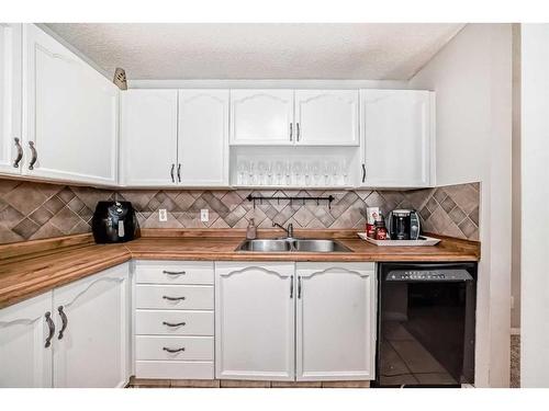 55 Millrise Lane Sw, Calgary, AB - Indoor Photo Showing Kitchen With Double Sink