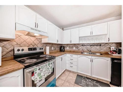 55 Millrise Lane Sw, Calgary, AB - Indoor Photo Showing Kitchen With Double Sink