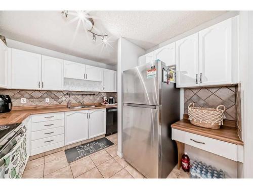 55 Millrise Lane Sw, Calgary, AB - Indoor Photo Showing Kitchen With Double Sink