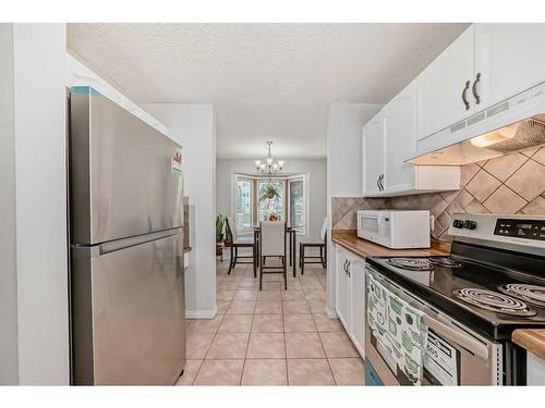 55 Millrise Lane Sw, Calgary, AB - Indoor Photo Showing Kitchen