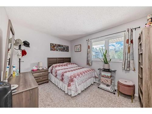 55 Millrise Lane Sw, Calgary, AB - Indoor Photo Showing Bedroom