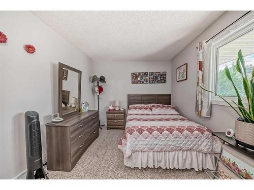55 Millrise Lane Sw, Calgary, AB - Indoor Photo Showing Bedroom