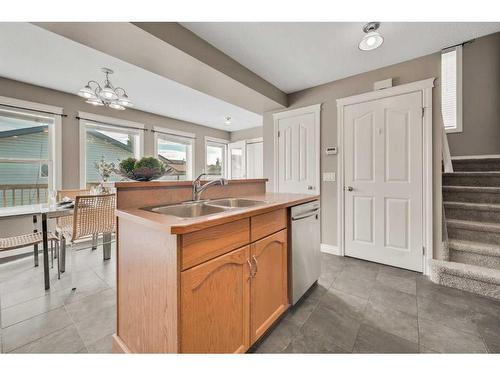 15909 Everstone Road Sw, Calgary, AB - Indoor Photo Showing Kitchen With Double Sink