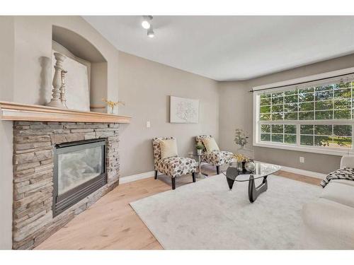 15909 Everstone Road Sw, Calgary, AB - Indoor Photo Showing Living Room With Fireplace