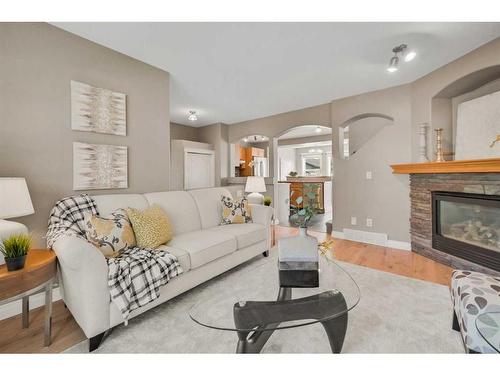 15909 Everstone Road Sw, Calgary, AB - Indoor Photo Showing Living Room With Fireplace