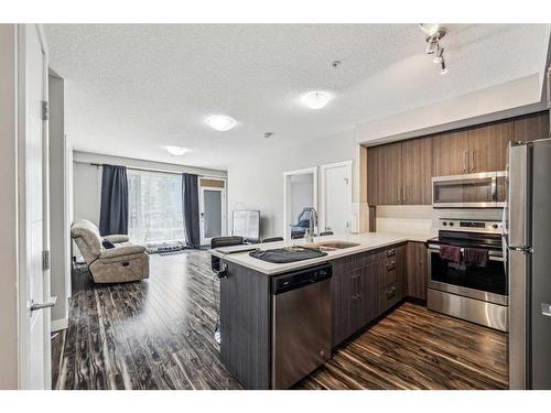 106-605 17 Avenue Nw, Calgary, AB - Indoor Photo Showing Kitchen With Stainless Steel Kitchen