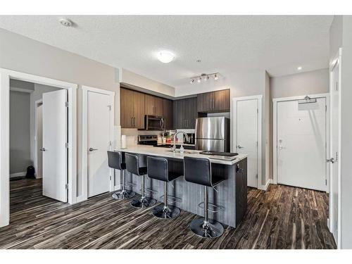 106-605 17 Avenue Nw, Calgary, AB - Indoor Photo Showing Kitchen With Stainless Steel Kitchen With Upgraded Kitchen