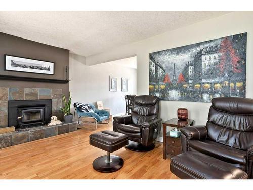 803 Seymour Avenue Sw, Calgary, AB - Indoor Photo Showing Living Room With Fireplace