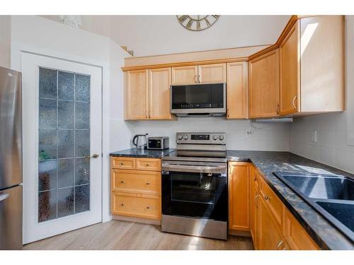 72 Crystal Shores Cove, Okotoks, AB - Indoor Photo Showing Kitchen