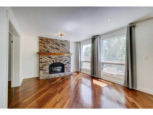 82 Edgebank Circle Nw, Calgary, AB - Indoor Photo Showing Living Room With Fireplace