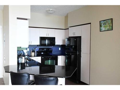 1217-8710 Horton Road Sw, Calgary, AB - Indoor Photo Showing Kitchen