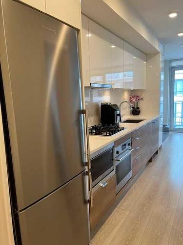 602-108 Waterfront Court Sw, Calgary, AB - Indoor Photo Showing Kitchen With Stainless Steel Kitchen With Upgraded Kitchen