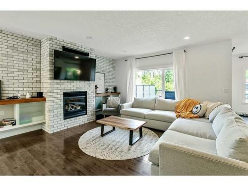 270 Discovery Ridge Way Sw, Calgary, AB - Indoor Photo Showing Living Room With Fireplace