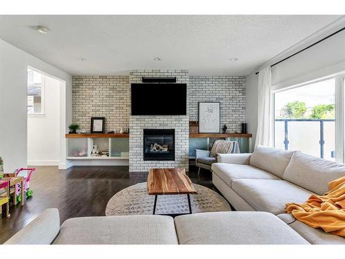 270 Discovery Ridge Way Sw, Calgary, AB - Indoor Photo Showing Living Room With Fireplace